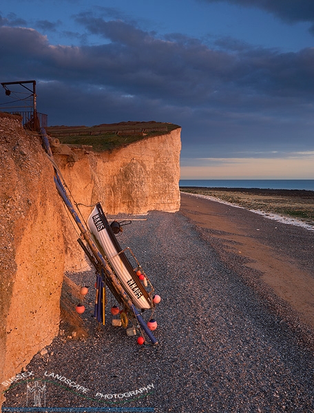 slides/Cliffside Mooring.jpg coast guard cottages east sussex coastal coast blue sky winter seaside cold bitter panoramic cliffs white seven sisters country park cuckmere haven beach storm rough sea sunset Cliffside Mooring